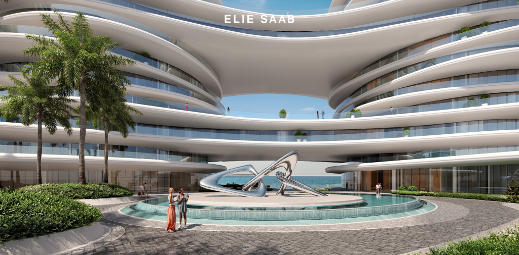 La Mer by Elie Saab’s striking architecture framed by palm trees and beachfront views.